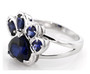side view of lab blue sapphire paw print ring in rhodium over sterling silver