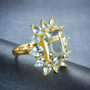 full view of prasiolite and blue topaz halo ring in 14k yellow gold over sterling silver