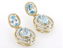 front view of blue zircon and diamond earrings in 14k yellow gold