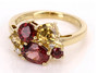 front view of red zircon yellow zircon and diamond cluster ring in 14k yellow gold