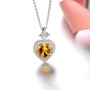 close up of citrine or blue topaz pendant necklace in rhodium over sterling silver