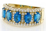 angled view of neon apatite and diamond five stone band ring in 14k yellow gold