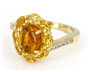 front view of amber citrine and zircon halo bypass ring in 18k yellow gold over sterling silver
