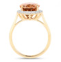 side view of orange tourmaline and diamond oval halo ring in solid 14k yellow gold