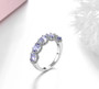 full view of tanzanite and white zircon band ring in rhodium over sterling silver