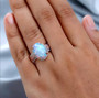 ethiopian opal pink and white diamond 10k rose gold halo ring on hand model