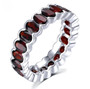 oval garnet bezel set eternity band ring in rhodium over sterling silver
