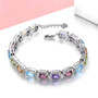 multi gemstone halo adjustable bracelet in rhodium over sterling silver shown in a lifestyle photo