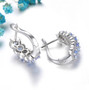 back view of tanzanite and zircon hoop earrings in rhodium over sterling silver