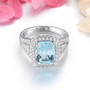 front view of sky blue topaz and white zircon halo ring in rhodium over sterling silver