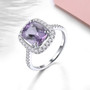 amethyst and white zircon halo ring in rhodium over sterling silver shown in a lifestyle photo