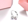 back view of tanzanite and rhodolite garnet bypass cluster ring in rhodium over sterling silver