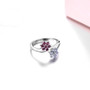 front view of tanzanite and rhodolite garnet bypass cluster ring in rhodium over sterling silver