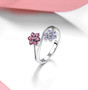 tanzanite and rhodolite garnet bypass cluster ring in rhodium over sterling silver shown in a lifestyle photo