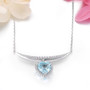 side view of heart sky blue topaz and white zircon necklace in rhodium over sterling silver