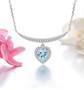 heart sky blue topaz and white zircon necklace in rhodium over sterling silver shown in a lifestyle photo