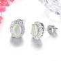 side view of oval ethiopian opal and white zircon halo stud earrings in rhodium over sterling silver