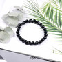 close up of round natural black tourmaline beaded stretch bracelet 6 8 or 10mm