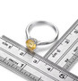 round citrine solitaire ring in rhodium over sterling silver shown for size comparison