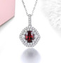rhodolite garnet and white zircon halo pendant necklace in rhodium over sterling silver shown in a lifestyle photo