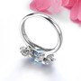back view of blue topaz amethyst and zircon flower ring in rhodium over sterling silver