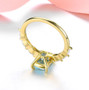 back view of sky blue topaz and white zircon ring in 18k yellow gold over sterling silver