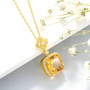 close up of citrine and white zircon pendant necklace in rhodium over sterling silver