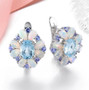 front view of sky blue topaz opal and tanzanite earrings in rhodium over sterling silver