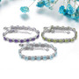 close up of swiss blue topaz adjustable bracelet in rhodium over sterling silver