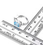 sky blue topaz and white zircon hoop earrings in rhodium over sterling silver shown for size comparison