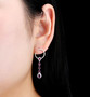 rhodolite garnet and white zircon earrings in rhodium over sterling silver worn on the ear