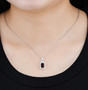garnet and white zircon pendant necklace in rhodium over sterling silver worn around the neck