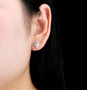 aquamarine and white zircon halo stud earrings in rhodium over sterling silver worn on the ear
