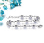 back view of tanzanite and white zircon halo adjustable bracelet in rhodium over sterling silver