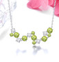 peridot and white zircon necklace in rhodium over sterling silver shown in a lifestyle photo