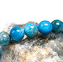 round natural blue apatite beaded stretch bracelet 6 8 or 10mm shown in a lifestyle photo