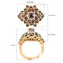 andalusite and moissanite cluster ring in 18k yellow gold over sterling silver shown for size comparison