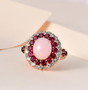 pink opal rhodolite garnet and zircon halo ring in 18k rose gold over sterling silver shown in a lifestyle photo