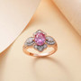 pink and white moissanite ring in 18k rose gold over sterling silver shown in a lifestyle photo