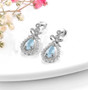 full view of aquamarine and white zircon earrings in rhodium over sterling silver