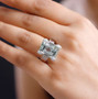 prasiolite and white zircon ring in rhodium over sterling silver worn on a hand