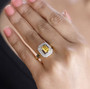 heliodor brown and white zircon butterfly ring in 18k yellow gold over sterling silver worn on a hand