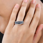 ceylon blue sapphire and moissanite band ring in rhodium over sterling silver worn on a hand