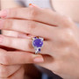 purple jade and multi gemstone halo ring in rhodium over sterling silver worn on a hand