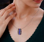 tanzanite and multi color sapphire pendant necklace in rhodium over sterling silver worn around the neck