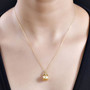 golden south sea pearl and diamond pendant necklace in 18k yellow gold over sterling silver worn around the neck