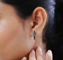 dragon head hoops with black spinel and chrome diopside in black and white rhodium over sterling silver shown being worn