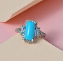 turquoise blue topaz and zircon ring in rhodium over sterling silver shown in a lifestyle photo