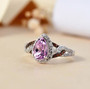 kunzite brown zircon and white zircon ring in rhodium over sterling silver shown in a lifestyle photo