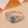blue and white moissanite gents ring in rhodium over sterling silver shown in a lifestyle photo